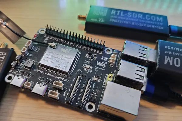 A Waveshare ESP32-P4-Module-DEV-KIT on the desk with an RTL-SDR Blog V3c and a V4L plugged into its USB-A ports